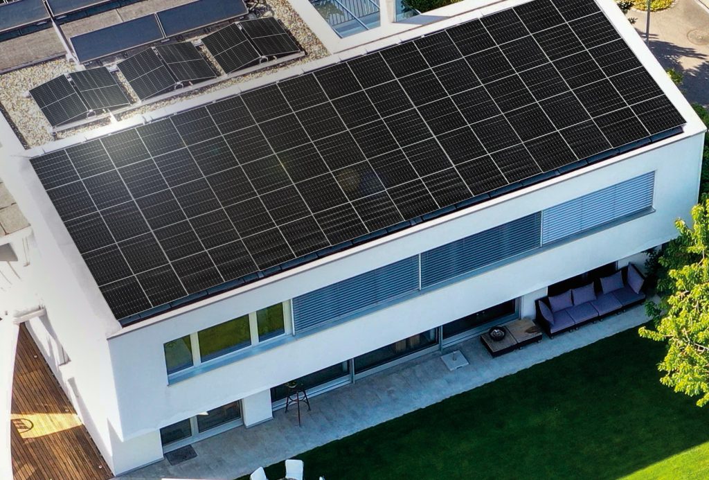 LG NeON H solar panels installed on a multi-level luxury home roof top occupying the entire surface area.