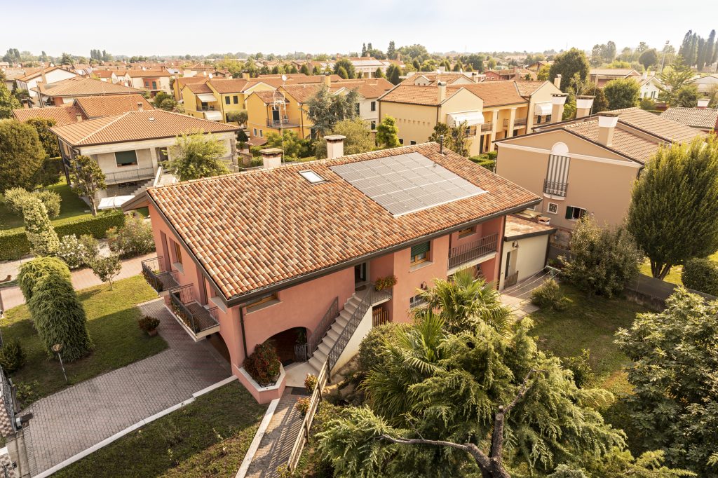 REC Solar Panels (Alpha Series) installed on a house roof top near Venice, Italy.